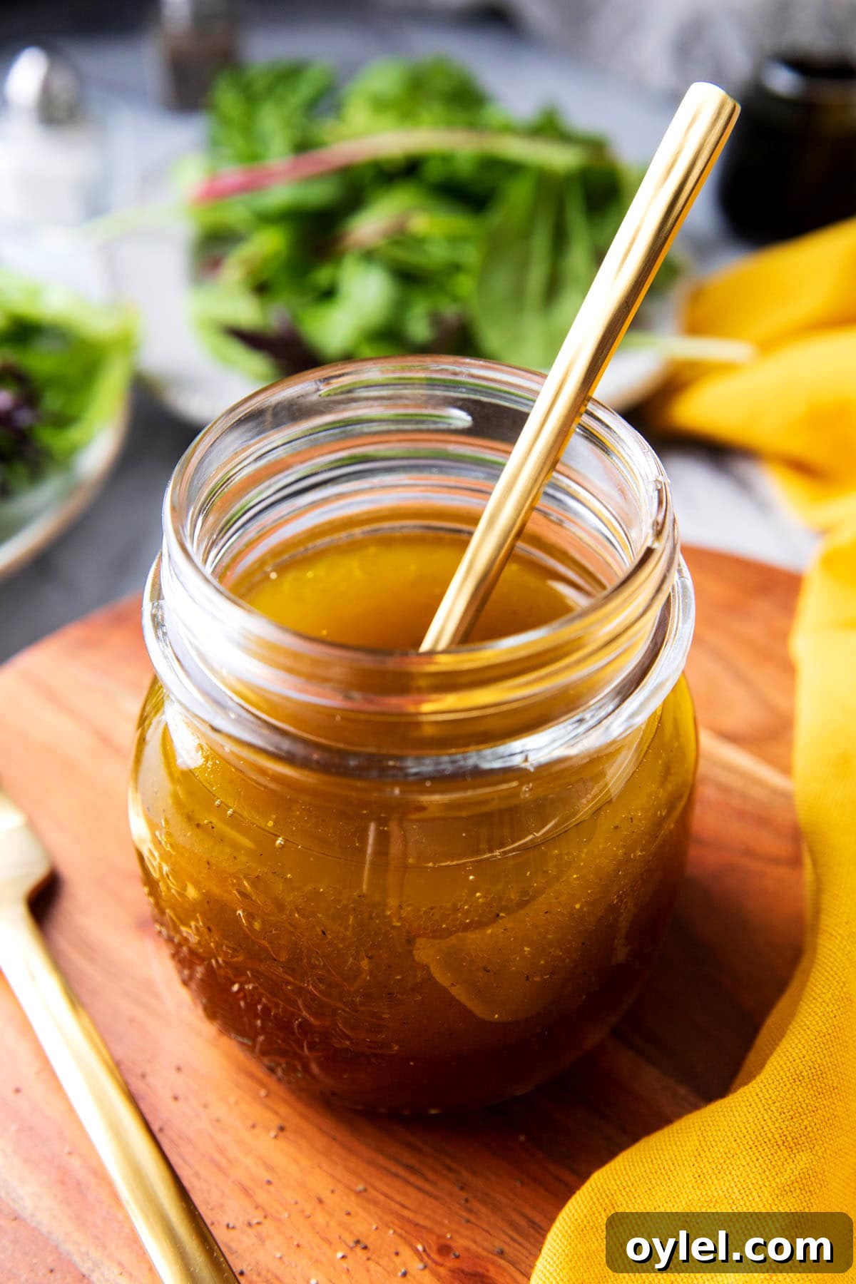 Maple Vinaigrette Recipe for Salads 5 A jar of this homemade salad dressing recipe with dijon and maple syrup shows flavorful olive oil, pure maple syrup, and a touch of apple cider vinegar for a tangy sweet dressing.