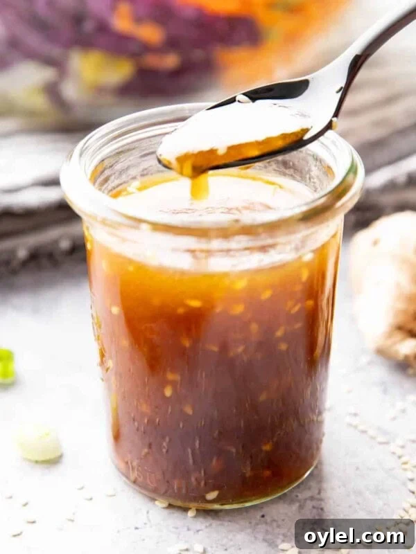 Maple Vinaigrette Recipe for Salads 7 Jar of asian salad dressing with sesame seeds floating in it