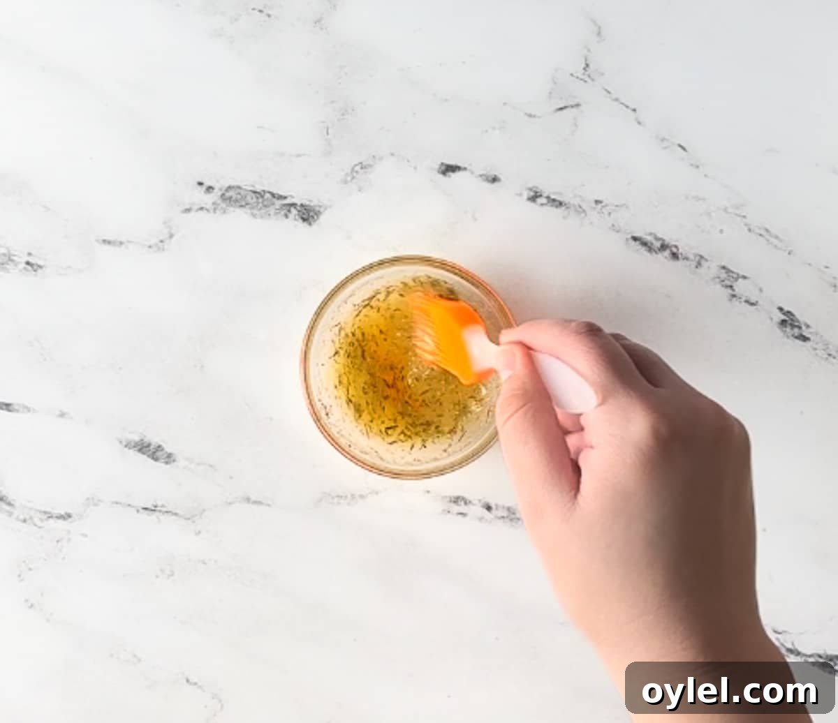 melted butter, dried thyme, and brown sugar is mixed in a bowl.