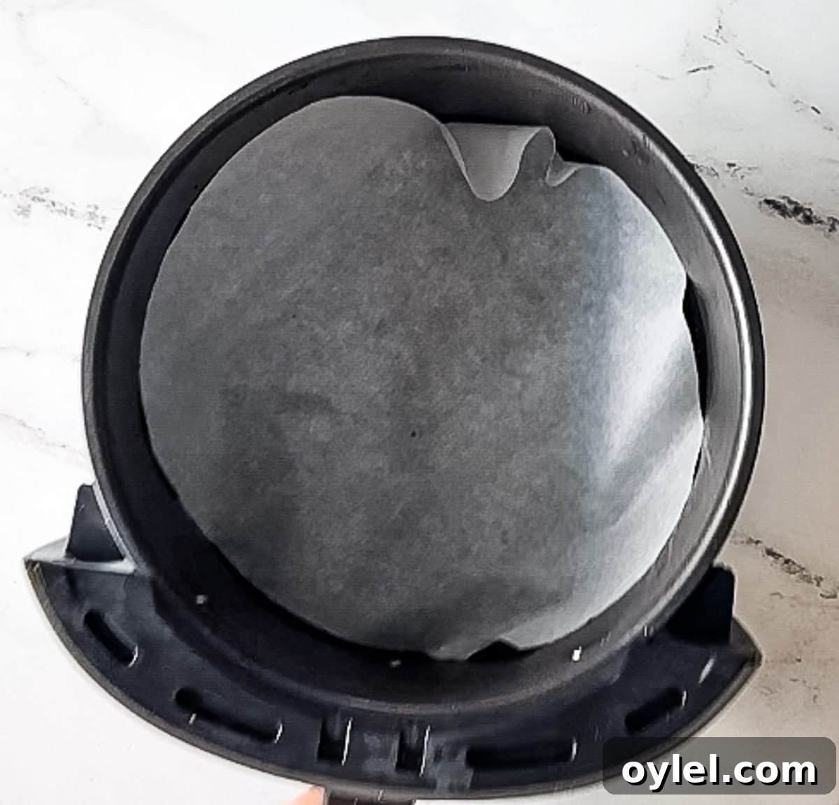 parchment paper in air fryer basket.