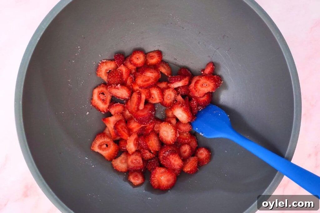 combine strawberries and sugar in a bowl