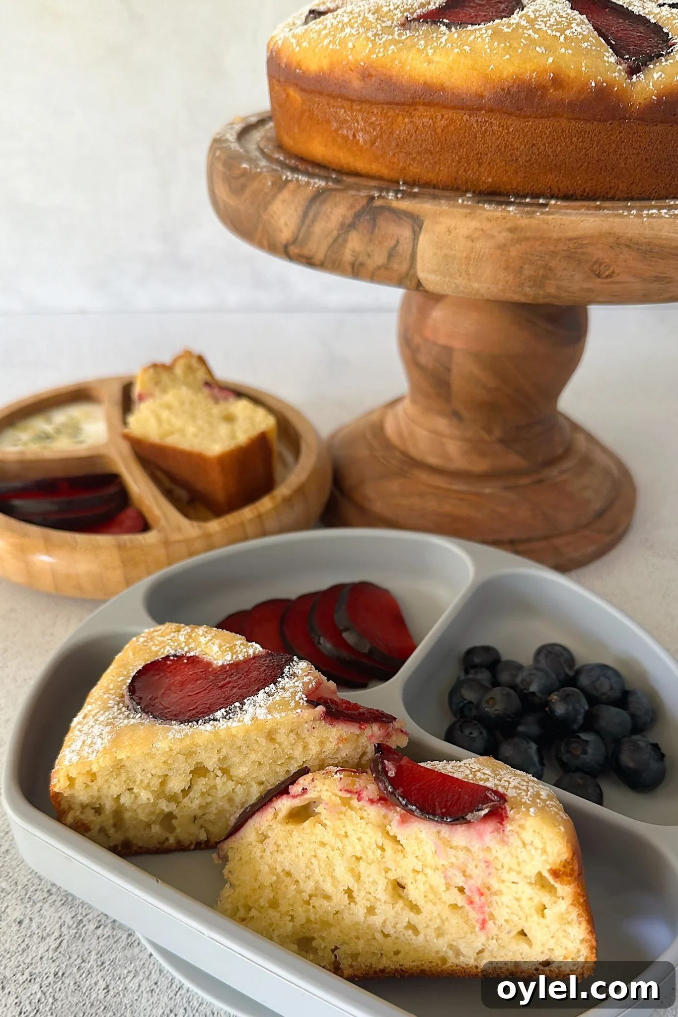 Moist Yogurt Plum Cake Recipe 2 Yogurt plum cake served with fruits.