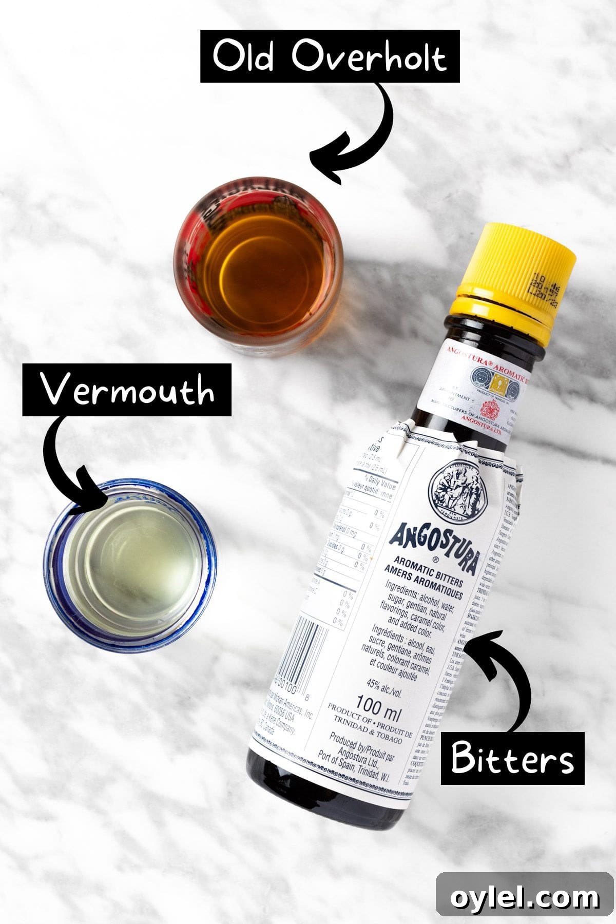The ingredients needed to make the Old Overholt whiskey cocktail.