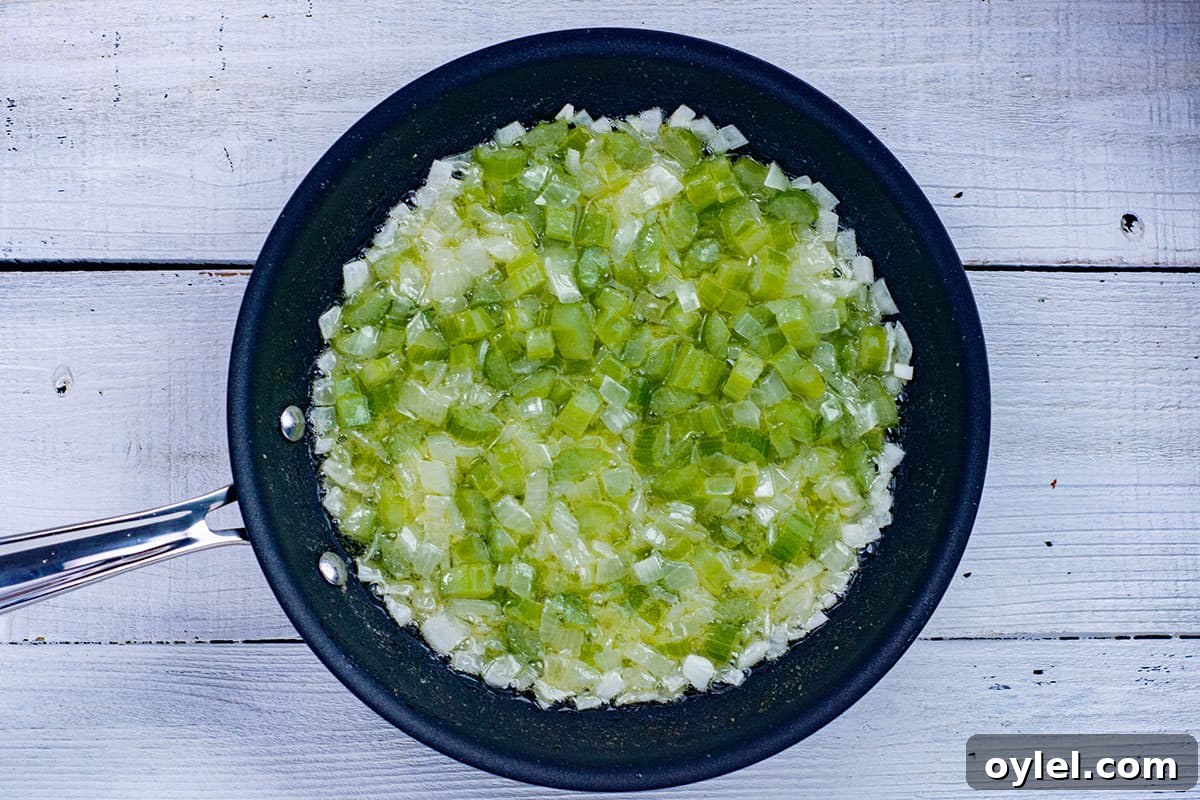 Classic Southern Cornbread Dressing Recipe 4 sauteed onion, bell pepper, and celery in skillet
