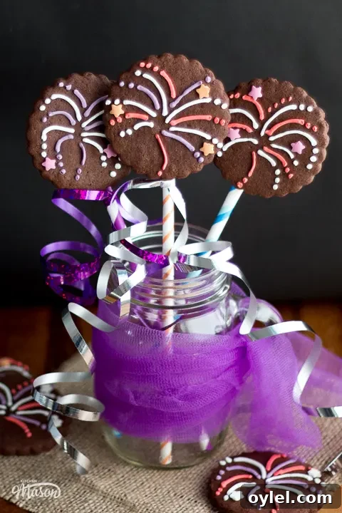 3 firework biscuits in a jar with purple nettings and colourful curling ribbon.