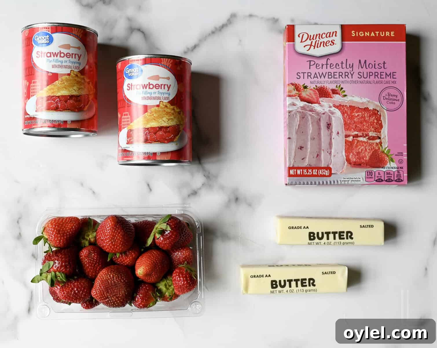 One-Bowl Strawberry Dump Cake Recipe 5 ingredients for strawberry dump cake - cake mix, strawberries, pie filling, and butter.