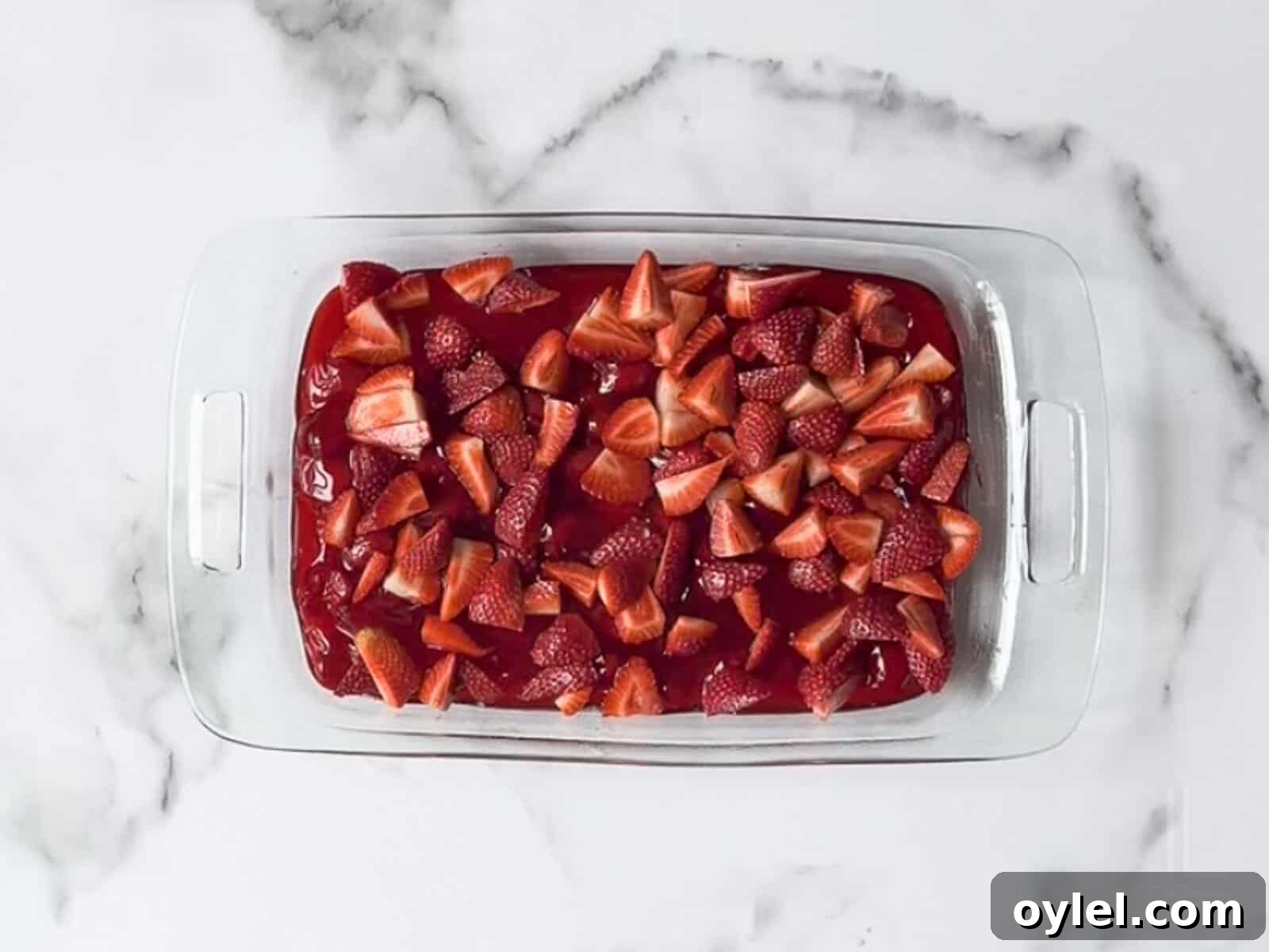 One-Bowl Strawberry Dump Cake Recipe 7 fresh strawberries scattered over the pie filling.