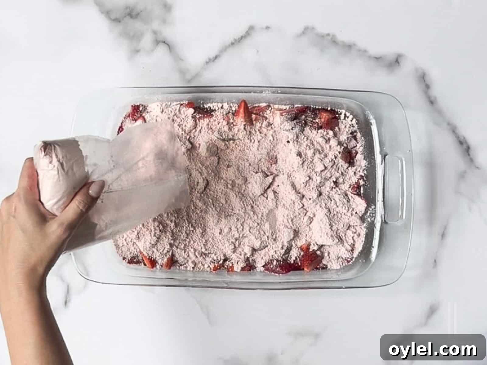 One-Bowl Strawberry Dump Cake Recipe 8 spreading dry cake mix over the strawberries.
