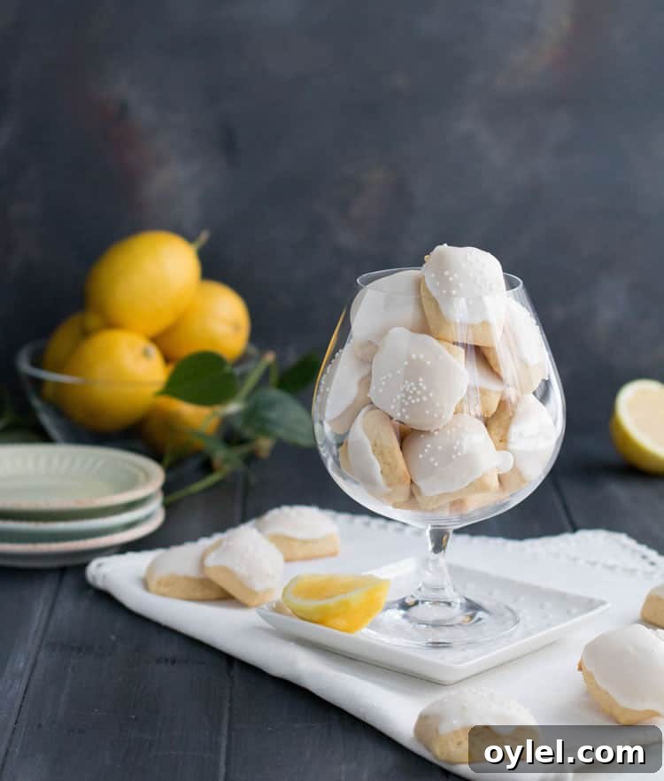 Iced Lemon Pillow Cookies Recipe with Zesty Glaze 2 Iced Lemon Pillow Cookies. A soft, petite, pillow shaped cookie, flavored with fresh lemon zest and then coated in fresh lemon icing. A perfect tea cookie!