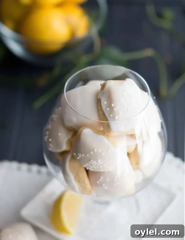 Iced Lemon Pillow Cookies Recipe with Zesty Glaze 5 Iced Lemon Pillow Cookies. A soft, petite, pillow shaped cookie, flavored with fresh lemon zest and then coated in fresh lemon icing. A perfect tea cookie!