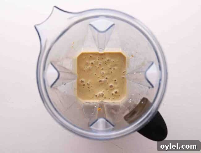 Creamy Pumpkin Vanilla Smoothie Recipe 3 Pumpkin smoothie in a blender.