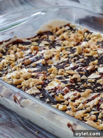 Drumstick Dessert in a glass pan on a wooden surface
