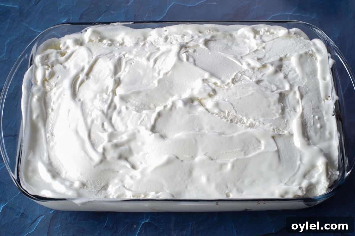 ice cream layer smoothed over fudge
