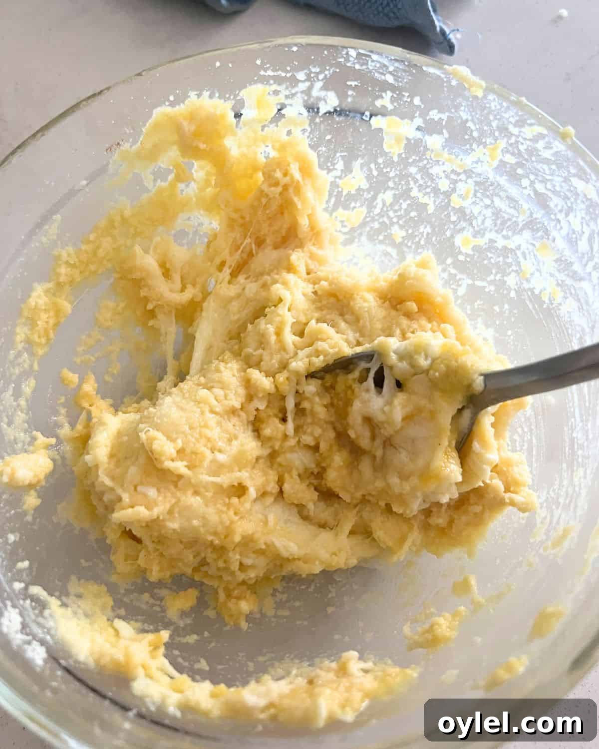 Fat head dough ingredients mixed together in a bowl.
