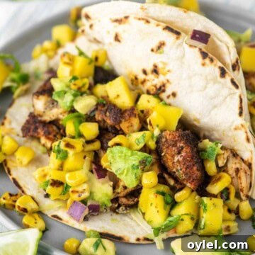 Rockfish tacos on grey plate.