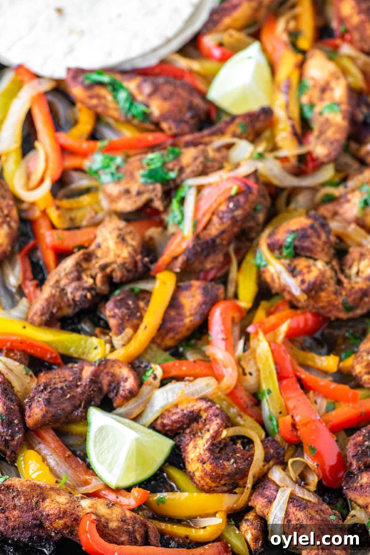Sheet Pan Chicken Fajitas Recipe with Peppers and Onions 8 Sheet pan chicken fajitas in sheet pan.