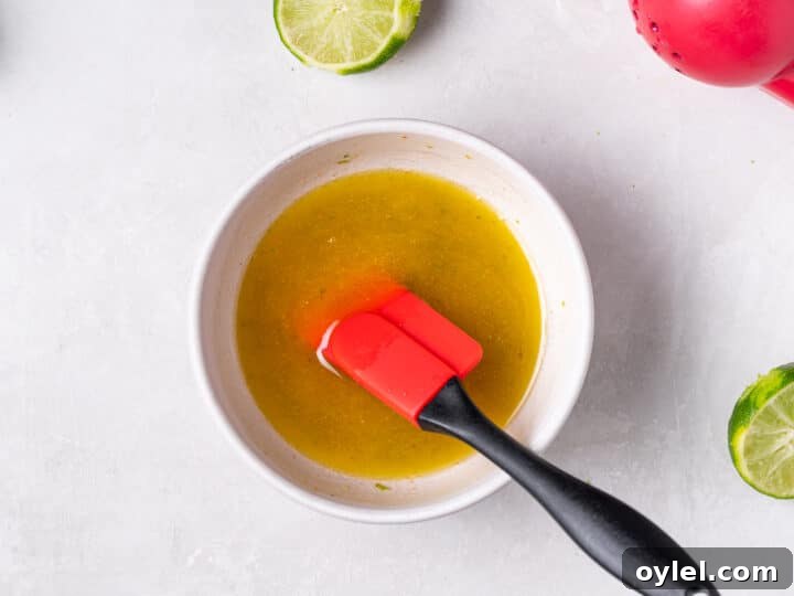 Crispy Roasted Honey-Lime Chicken Thighs 8 Mixing sauce in a bowl until smooth and combined