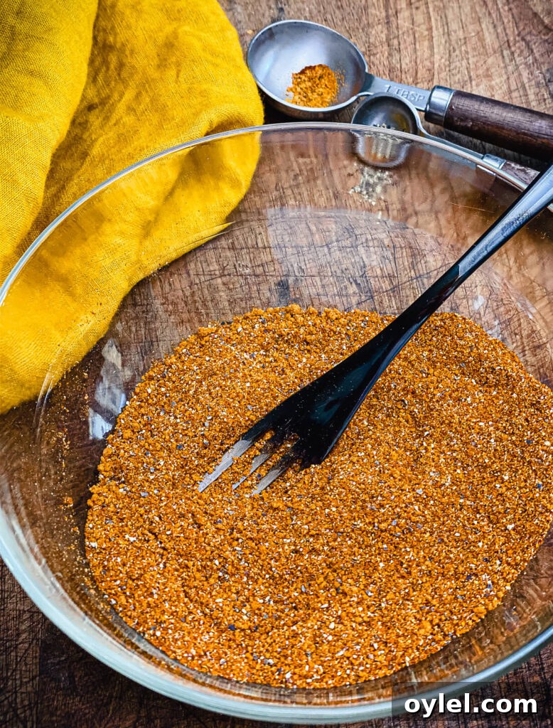 Nashville Hot Seasoning Recipe: Homemade Spice Blend 5 Nashville hot seasoning in a bowl with a fork