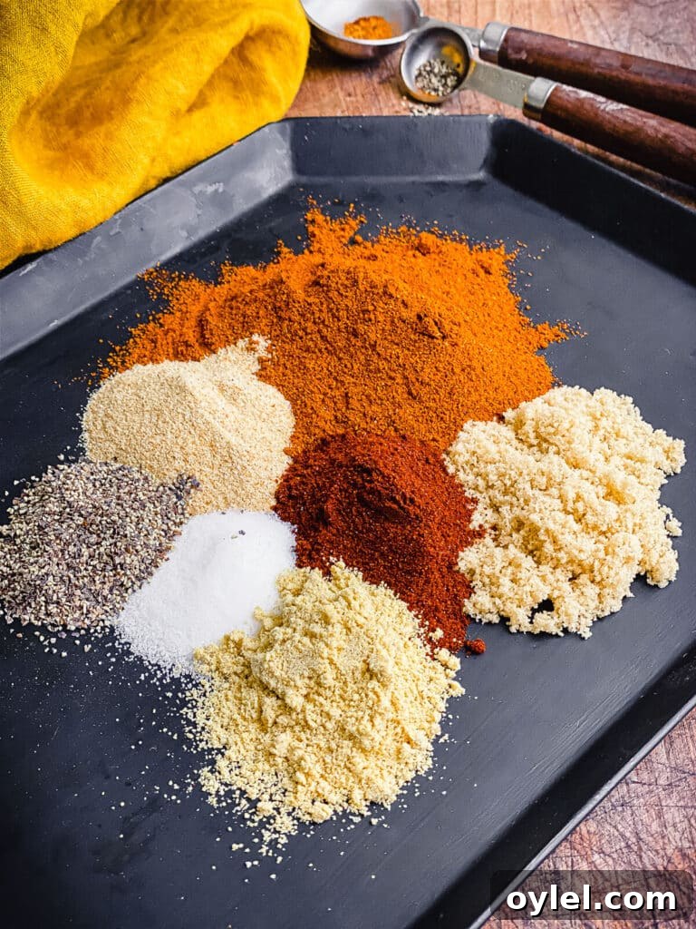 Nashville Hot Seasoning Recipe: Homemade Spice Blend 6 ingredients for Nashville hot seasoning on a black plate