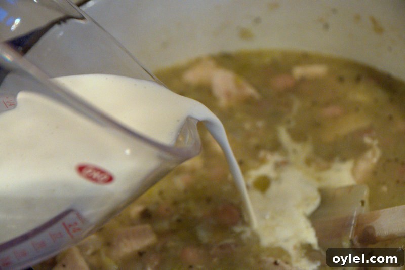 Adding cream to soup Adding cream to white chicken chili soup