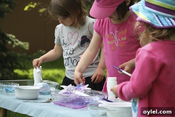 Melt Elsa's Frozen Hands: Preschool Sensory Science Experiment 5 preschoolers melting ice with water and salt