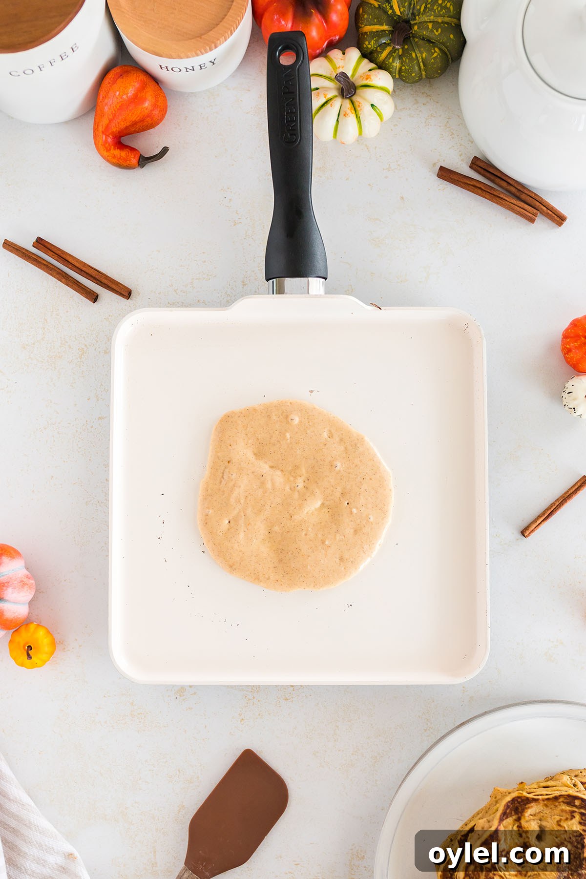 Pancake batter is poured into a pan.