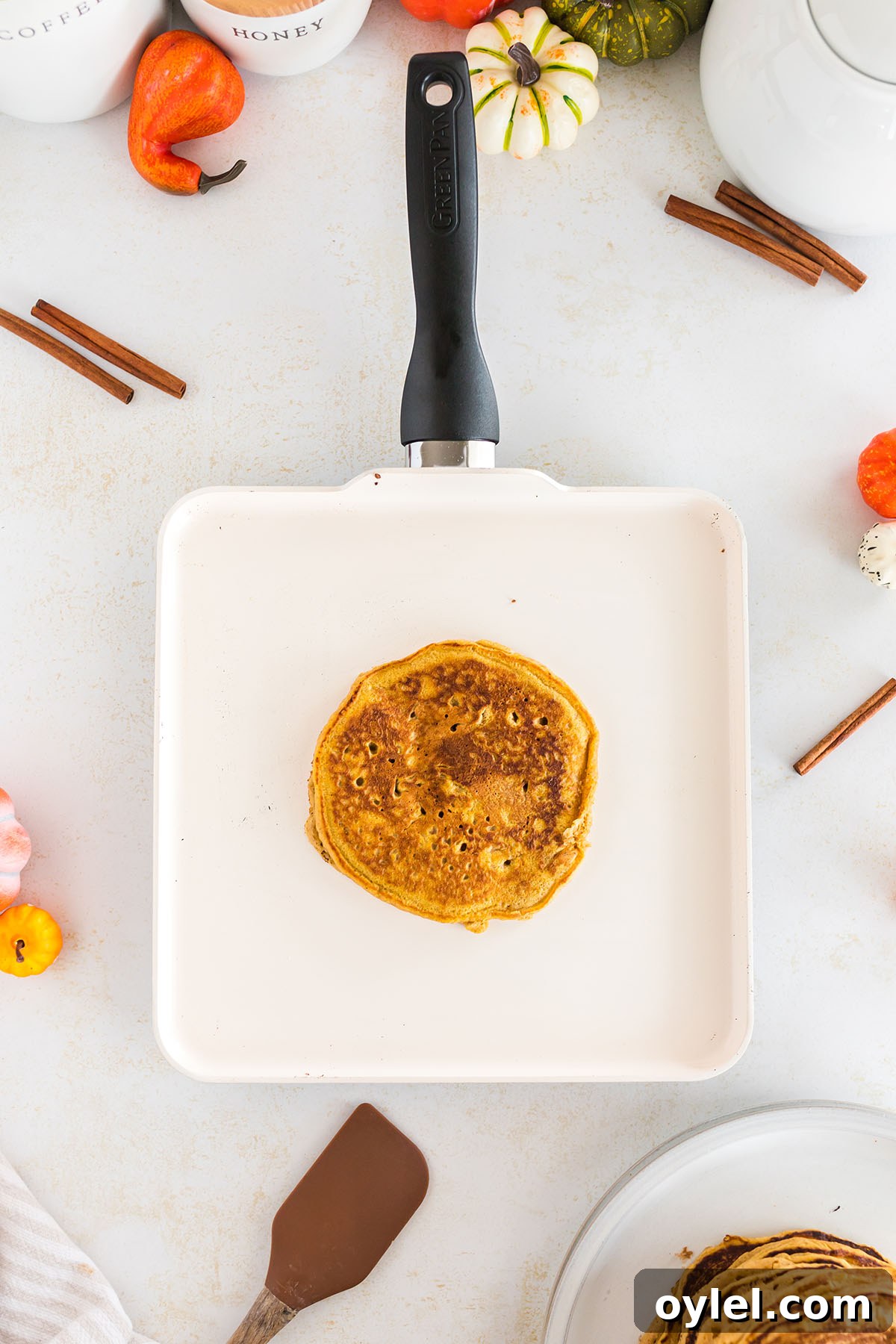 Pumpkin pancake cooked in a pan.