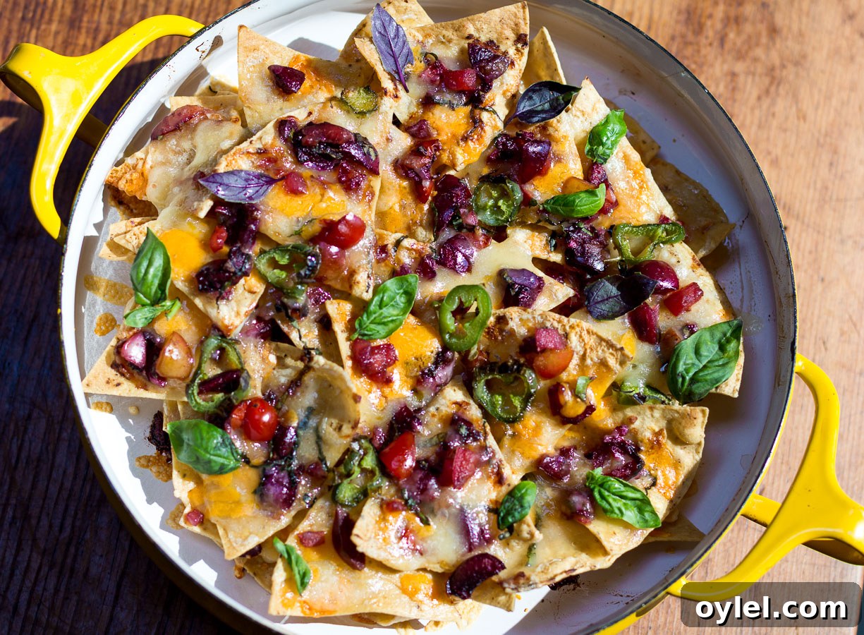 20 Spring Recipes to Brighten Your Table 13 Fresh Cherry Salsa over layered Nachos in a vintage pan