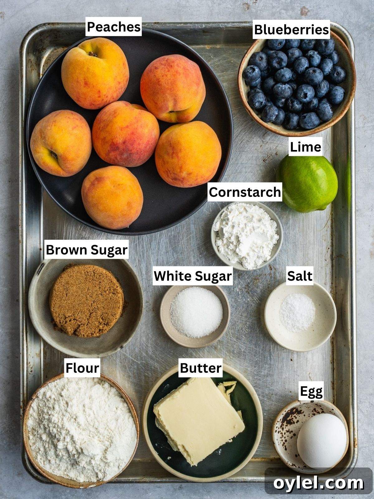 Blueberry Peach Galette Recipe with Lime and Brown Sugar 3 Blueberry Peach Galette recipe ingredients on a tray.