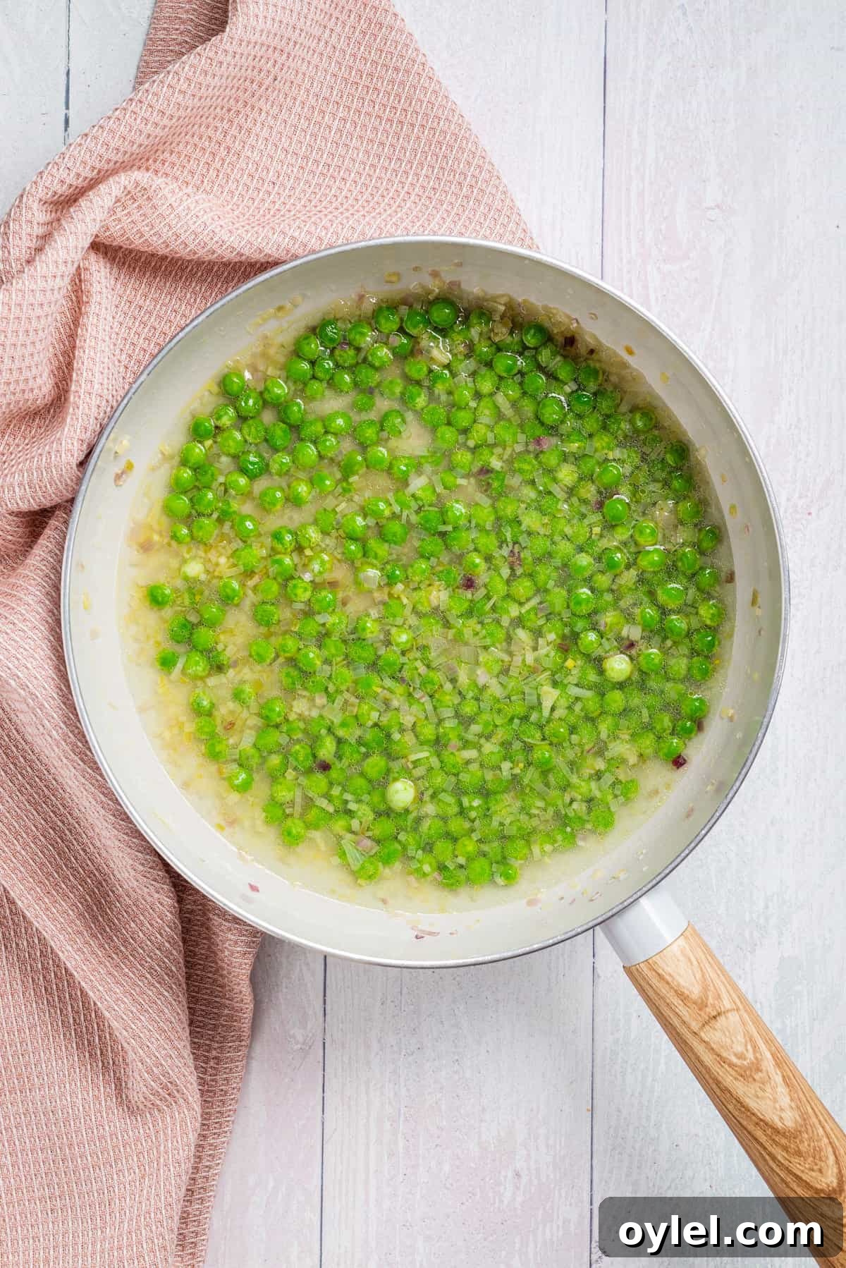 Pasta e Piselli Recipe: Classic Italian Pasta with Peas 6 Peas cooking with shallots