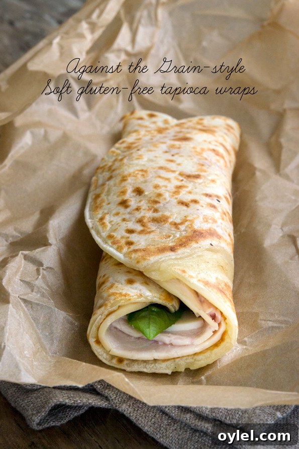 Soft Grain-Free Tapioca Wrap Recipe 8 Close up image of a soft tapioca wrap rolled into a turkey sandwich
