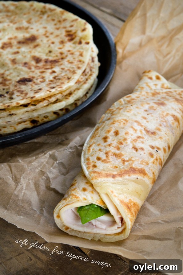 Soft Gluten Free Tapioca Wraps A stack of soft tapioca wraps and one made into a sandwich