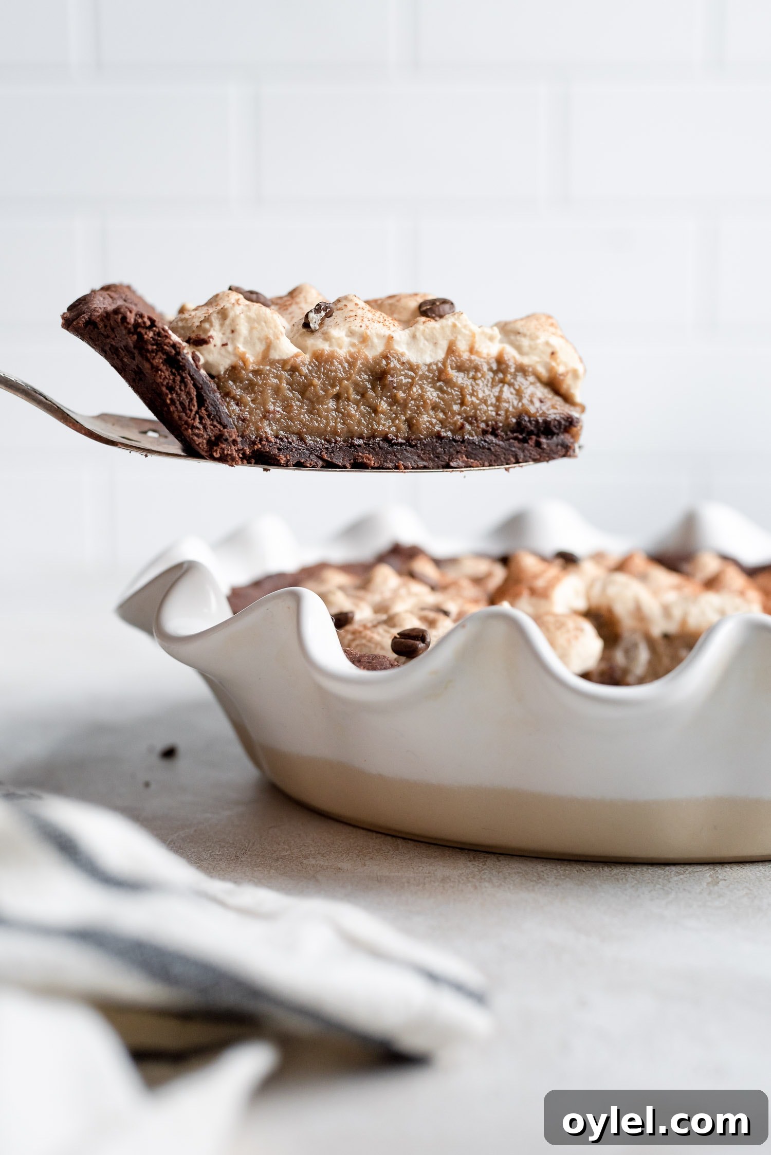 pie slice being pulled out of pie pan