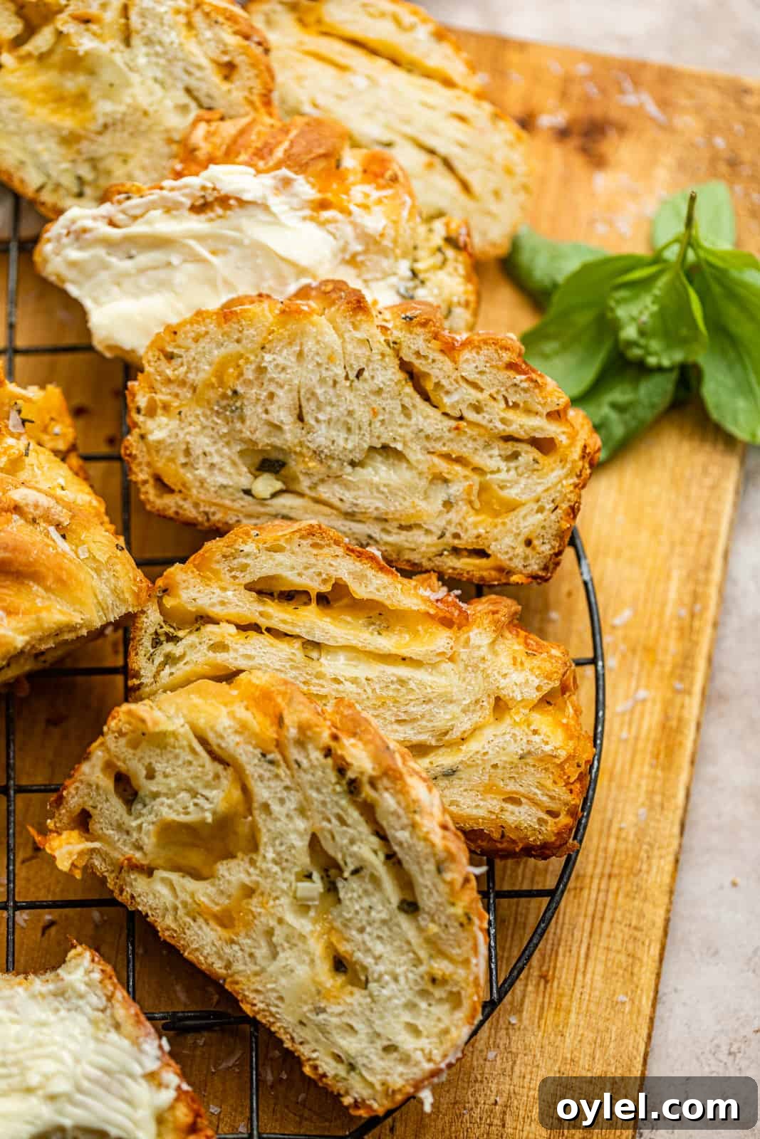 sliced cheese babka on a cooling rack.