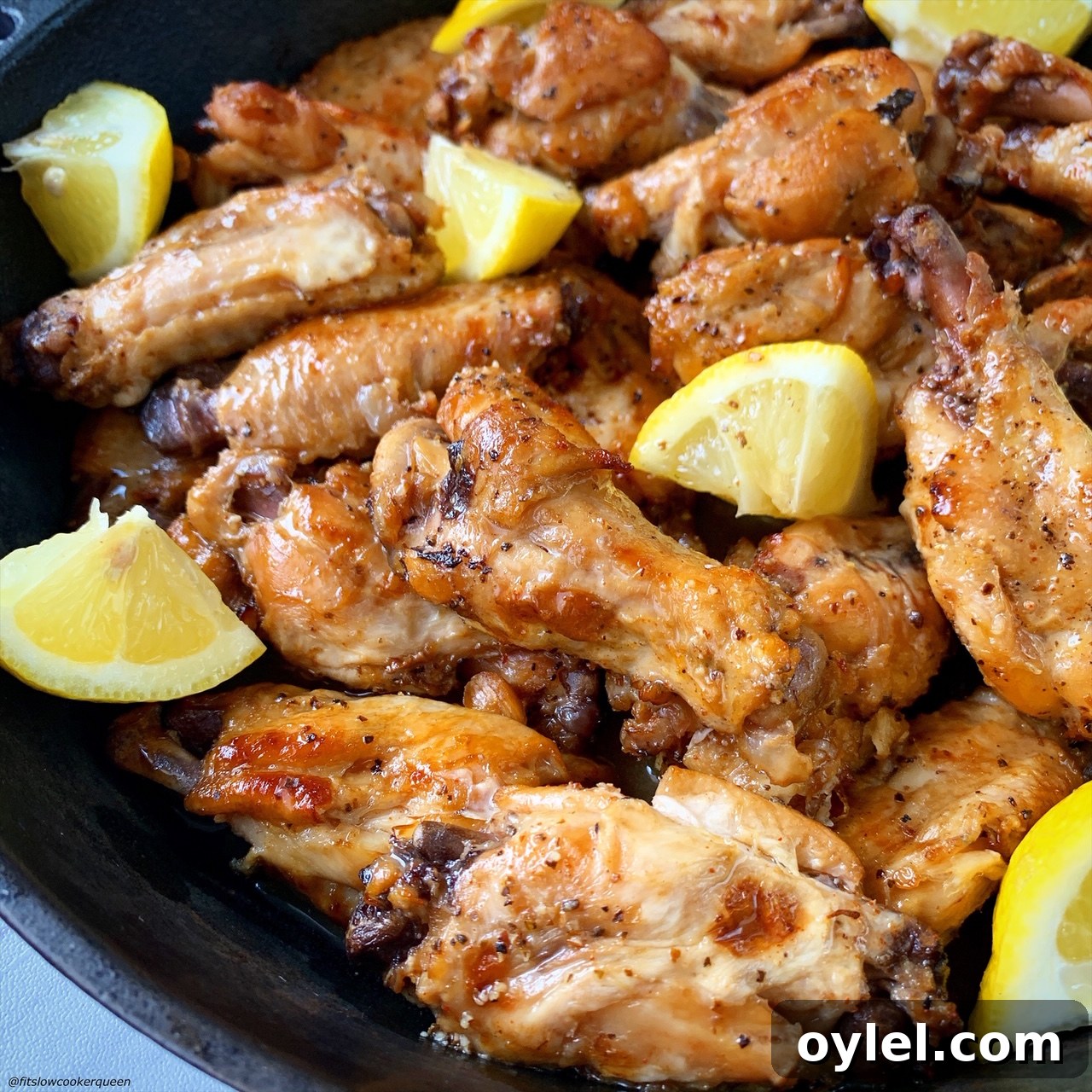 close up of broiled, cooked lemon pepper chicken wings
