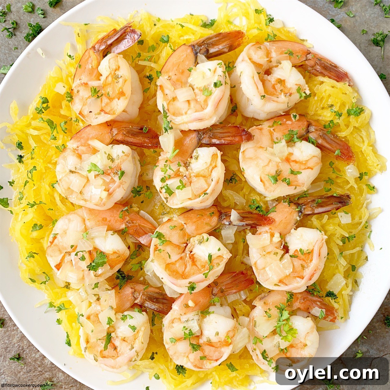 Lighten up your shrimp scampi with this slow cooker version. This easy shrimp scampi recipe is served with spaghetti squash and cooked all in one pot.