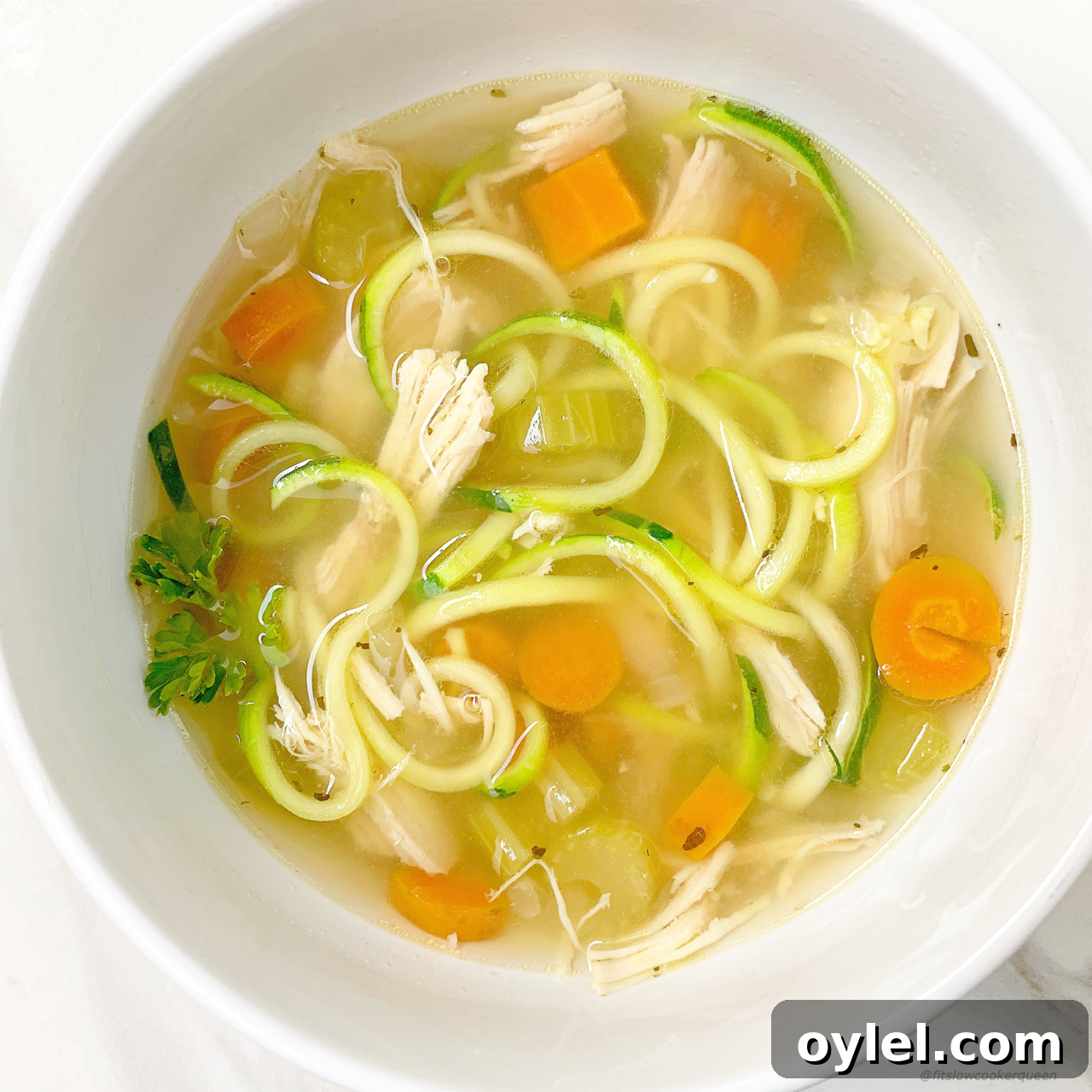 Zoodles lighten up this low-carb, paleo, and whole30 chicken soup recipe that can be made in your slow cooker or Instant Pot.