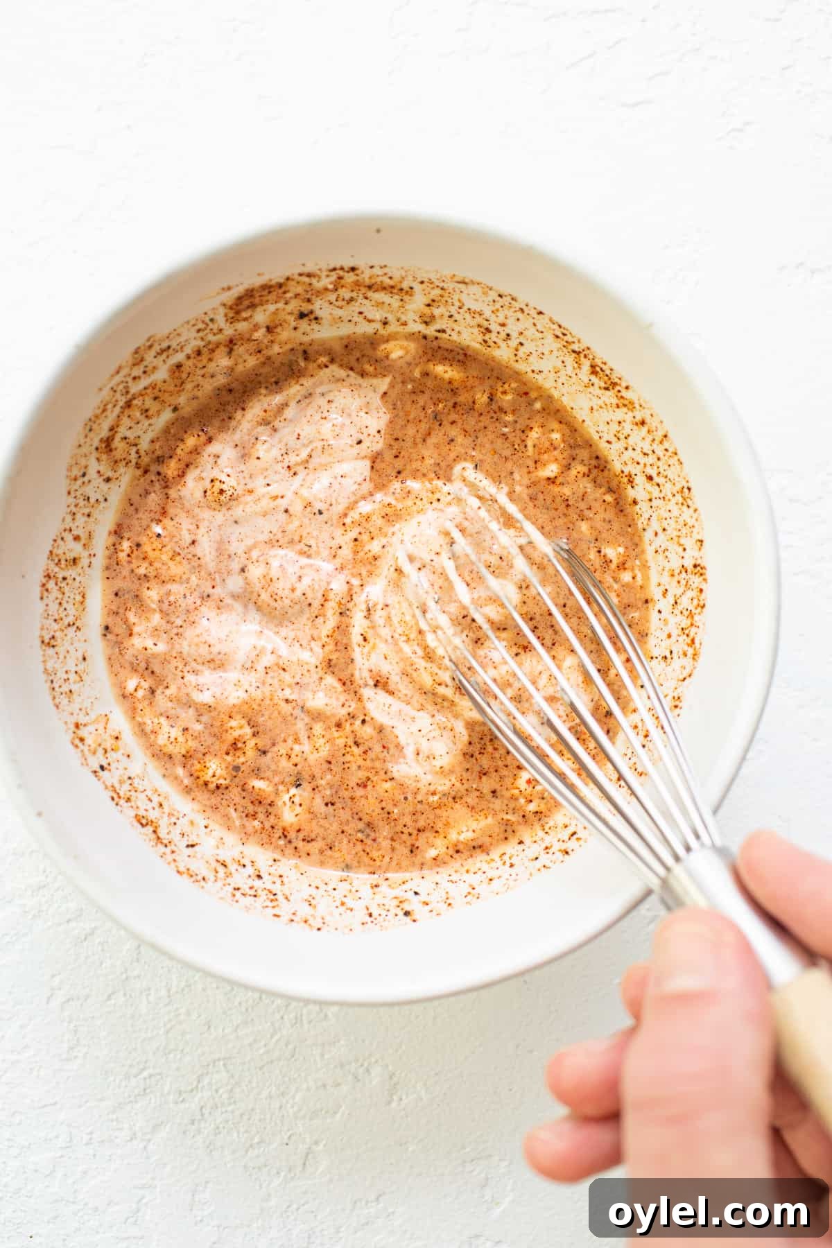 This easy burger sauce is our go-to recipe! No more store-bought burger sauce filled with ingredients you can’t pronounce. You'll never make burgers without this sauce again! Burger sauce ingredients being whisked together in a bowl.