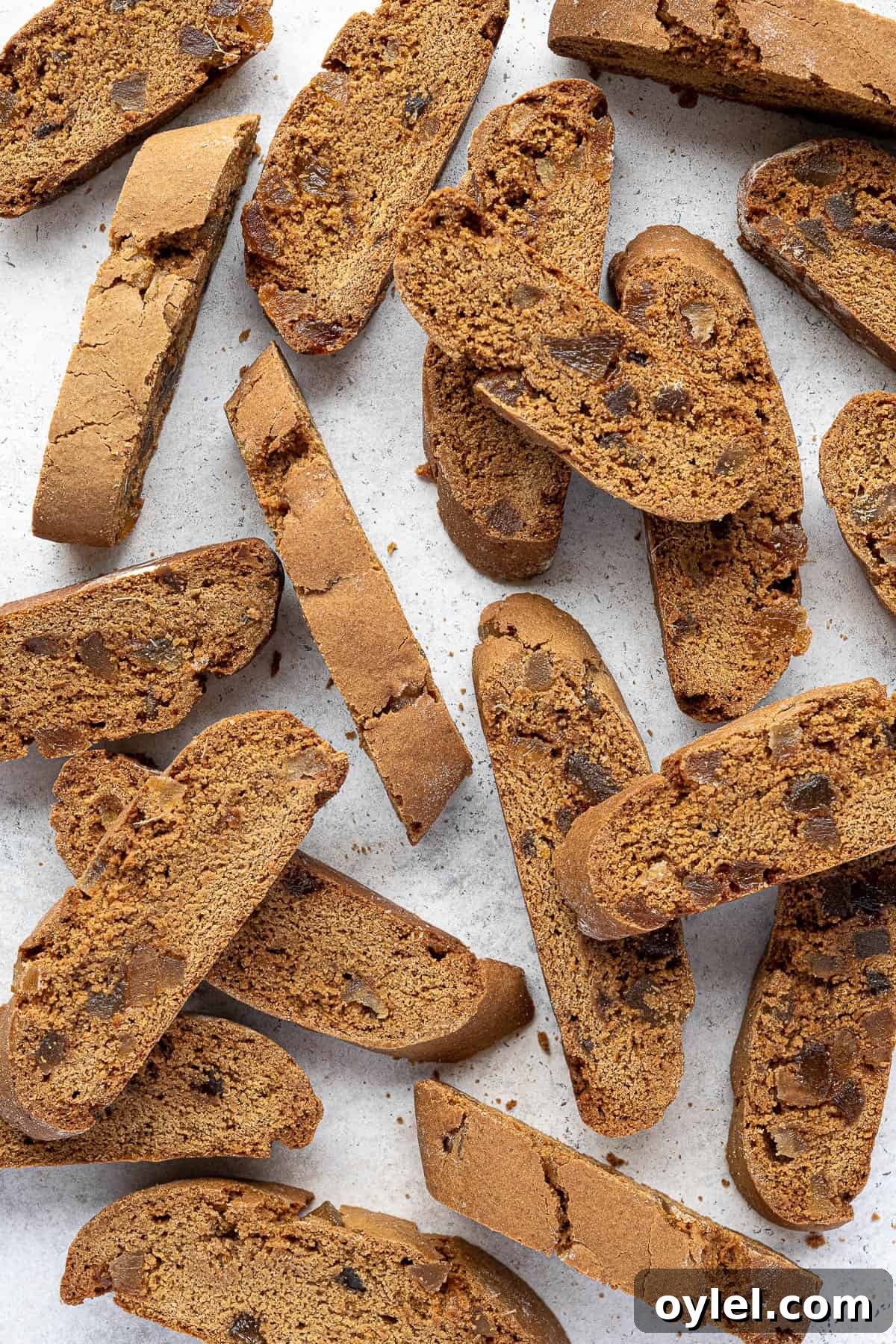 Vegan ginger biscotti on a white surface.