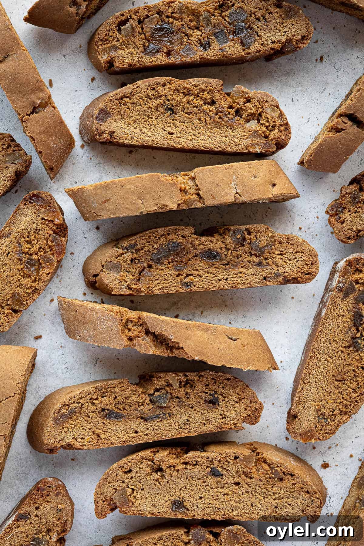 Gingerbread biscotti arranged in a row.