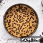 How to Make a Chocolate Chip Cookie Cake 12 chocolate chip cookie cake in a pan before baking