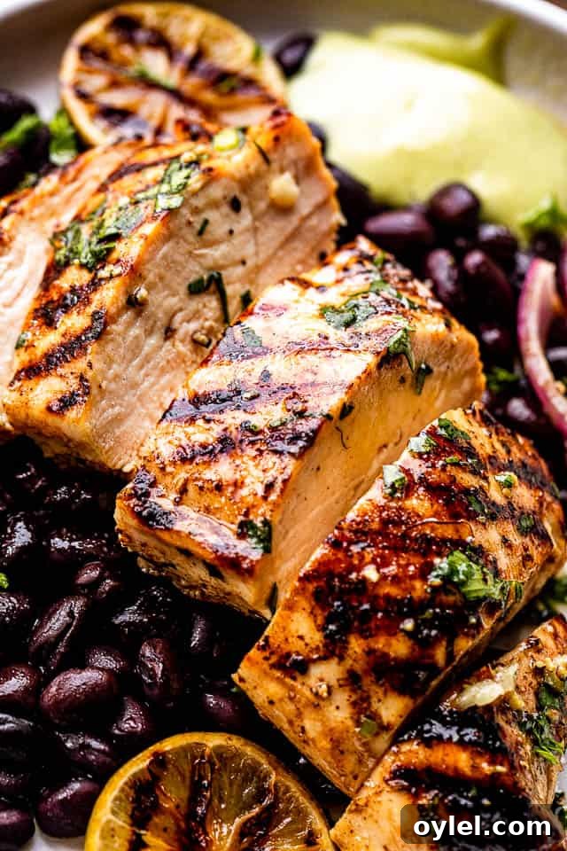 Cuban Mojo Grilled Chicken with Citrus Garlic Marinade 2 Sliced grilled chicken breast set over black beans