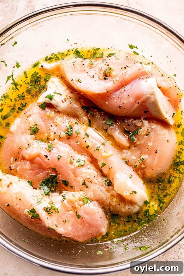 Cuban Mojo Grilled Chicken with Citrus Garlic Marinade 3 Marinating chicken breasts in orange juice