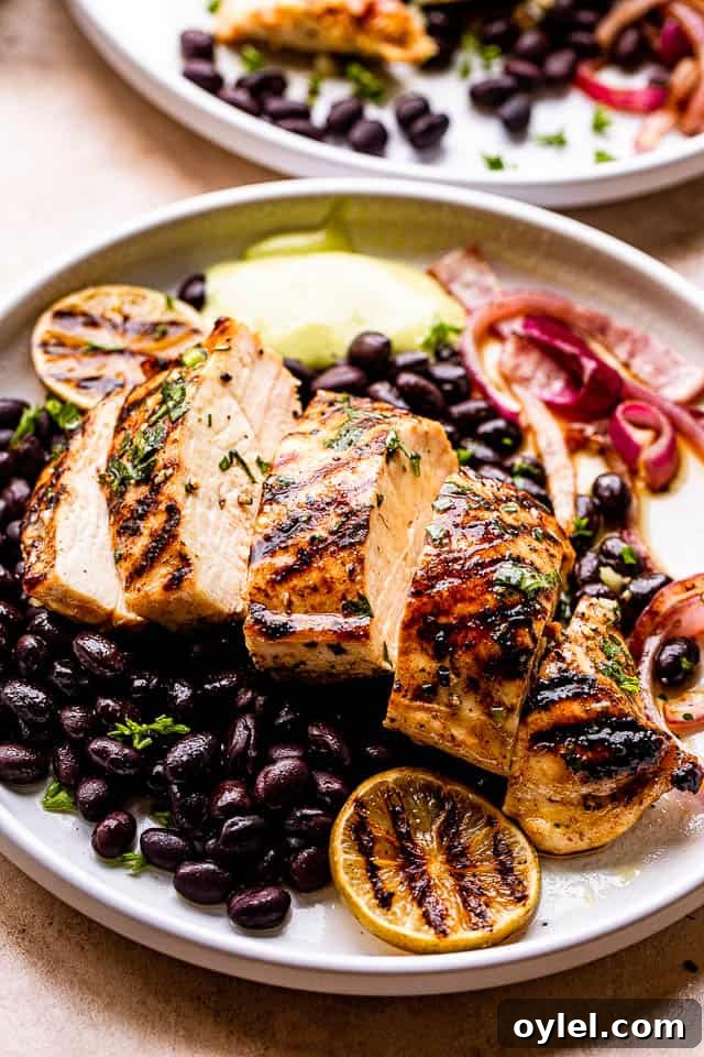 Cuban Mojo Grilled Chicken with Citrus Garlic Marinade 5 Grilled Mojo Chicken Breast cut in slices and served over black beans and guacamole to the side.