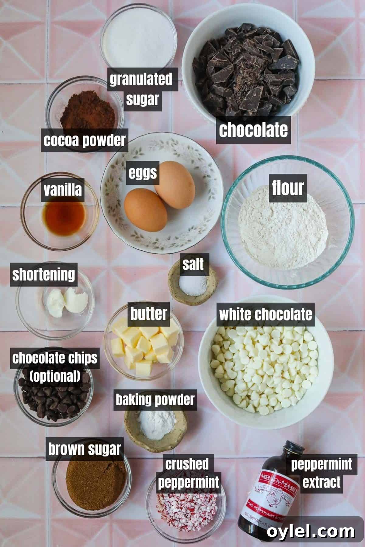 Ingredients for making peppermint bark brownie cookies arranged on a flat surface.