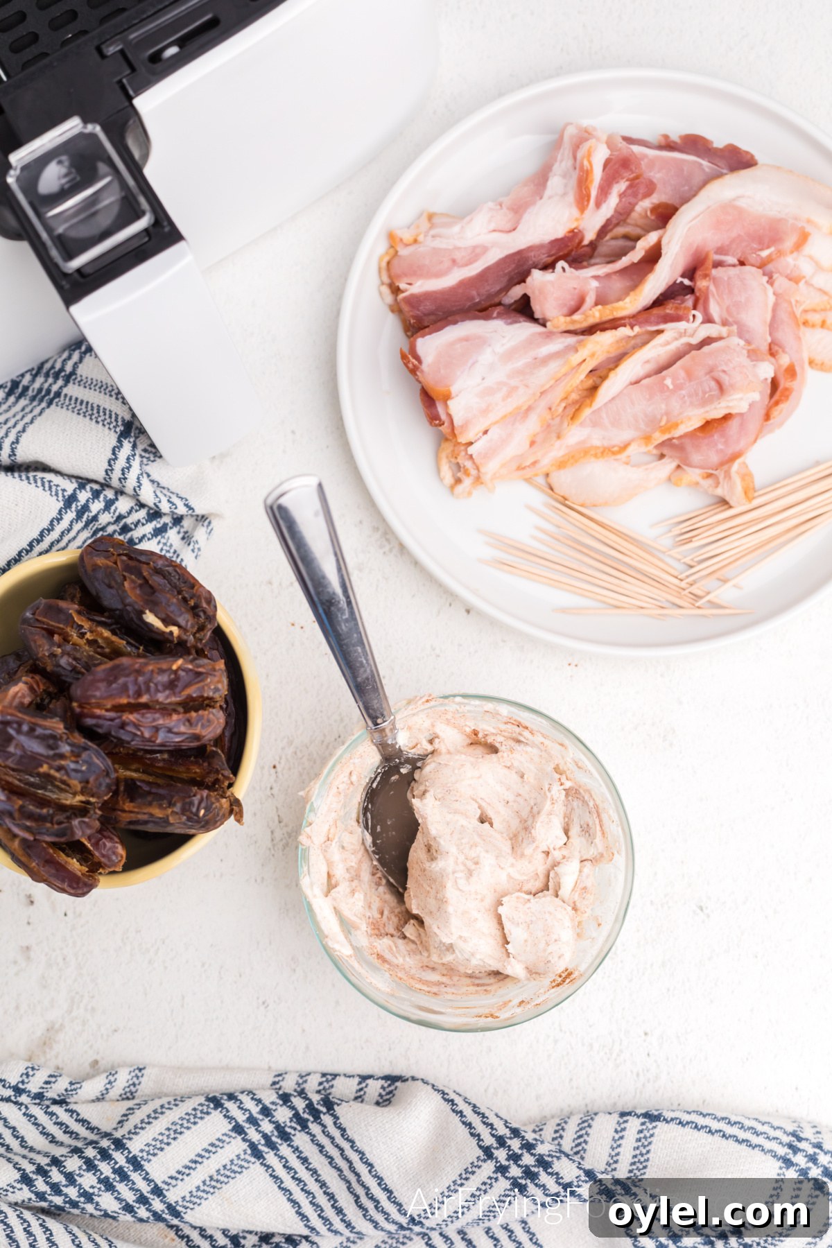 Air Fryer Bacon-Wrapped Dates Recipe 5 Cinnamon and cream cheese mixed together in a small bowl.