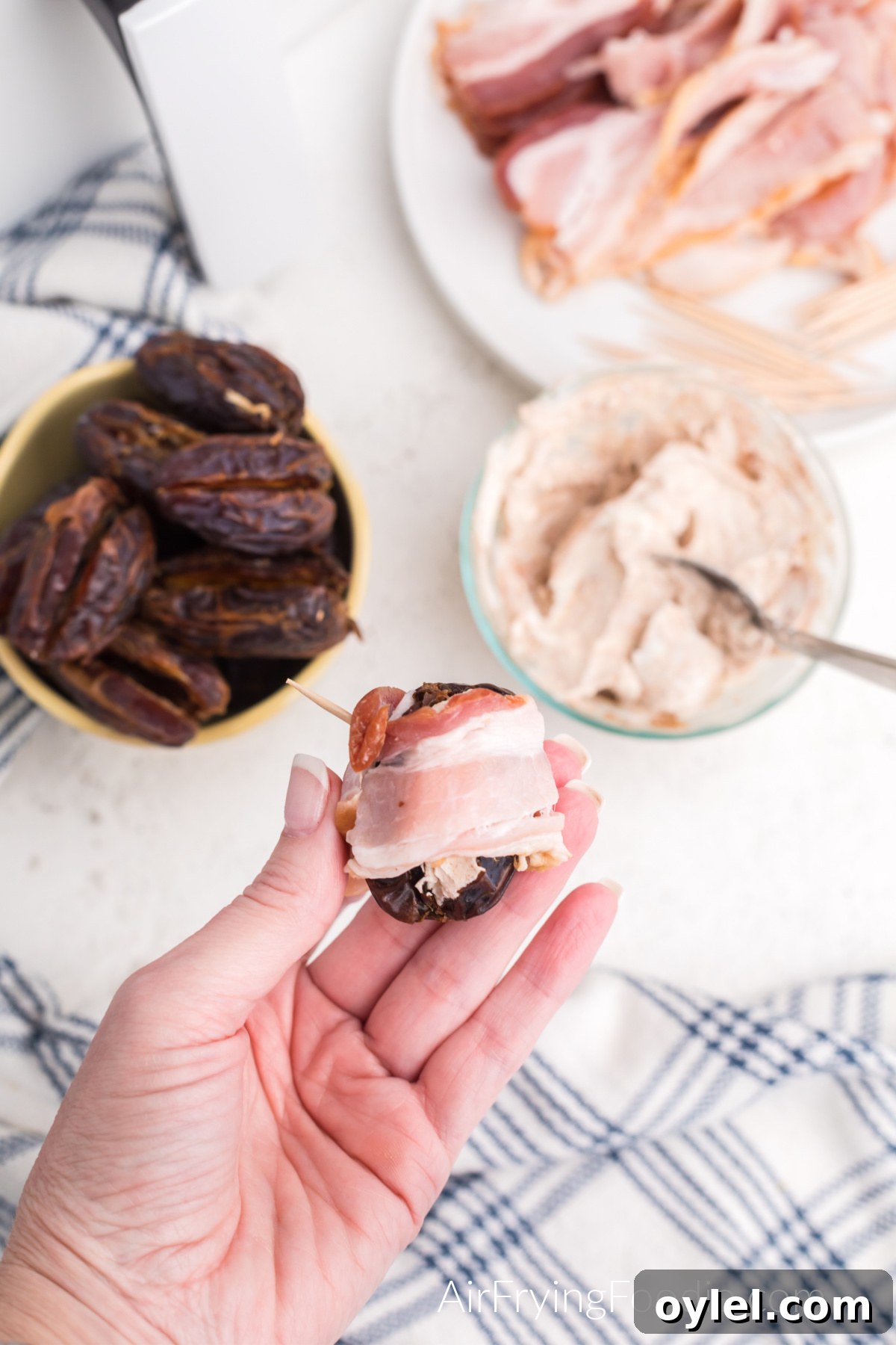 Air Fryer Bacon-Wrapped Dates Recipe 7 Bacon wrapped around the stuffed date.
