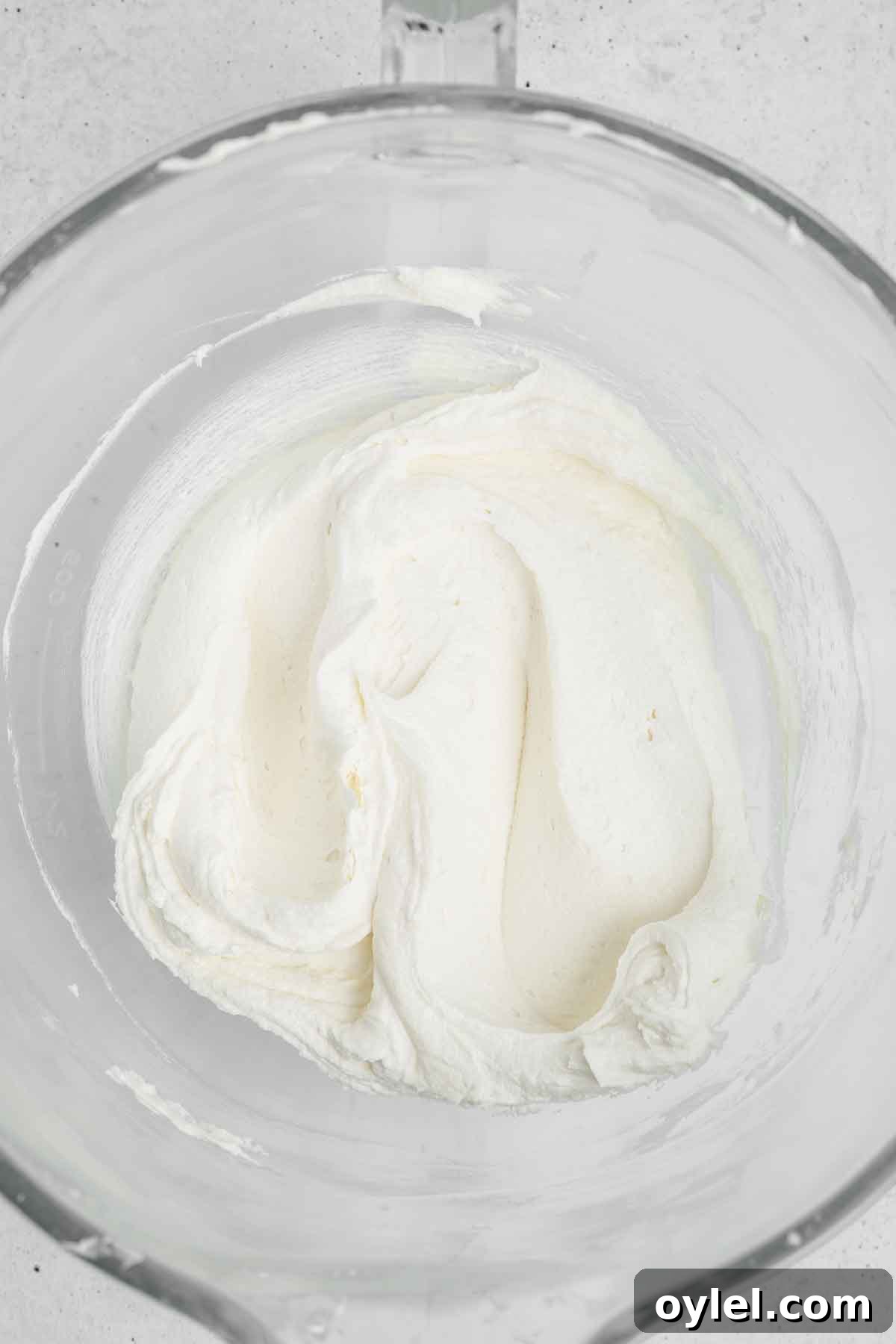 smooth vanilla buttercream frosting whipped in a mixing bowl
