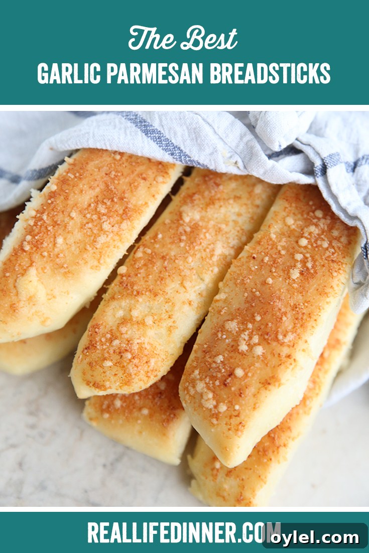 Garlic Parmesan Breadsticks: Soft, Cheesy Homemade Recipe 8 Pinterest picture with the text of the title at the top.