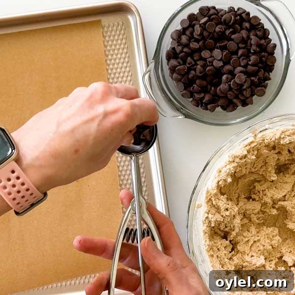 Gluten Free Cassava Flour Chocolate Chip Cookies Recipe 6 Adding chocolate chips to cookie scoop.